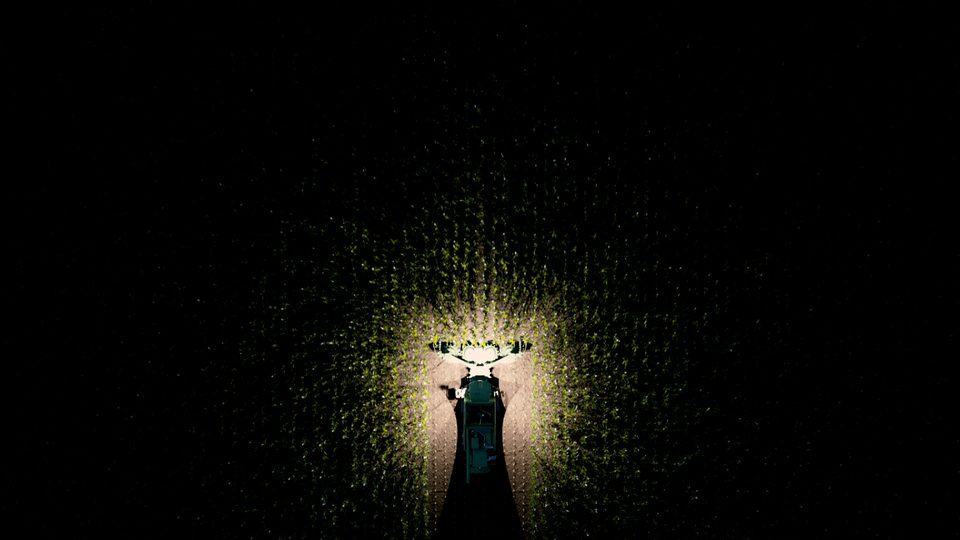 aerial view of a field robot illuminating a field at night