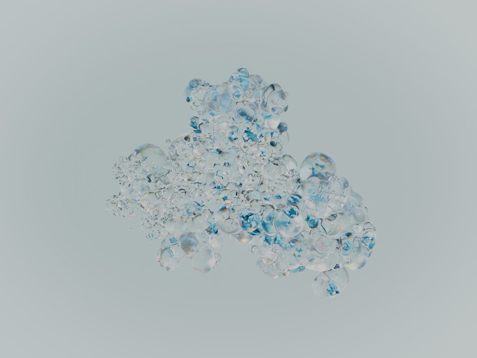 dense cluster of transparent, bluish shimmering bubble shapes against a light grey background