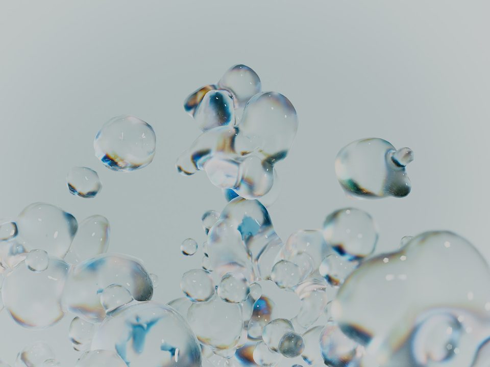 floating transparent bubble shapes of varying size against a light grey background