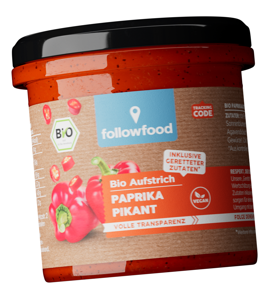 close-up of a followfood organic spread jar „Spicy Paprika“ against a black background