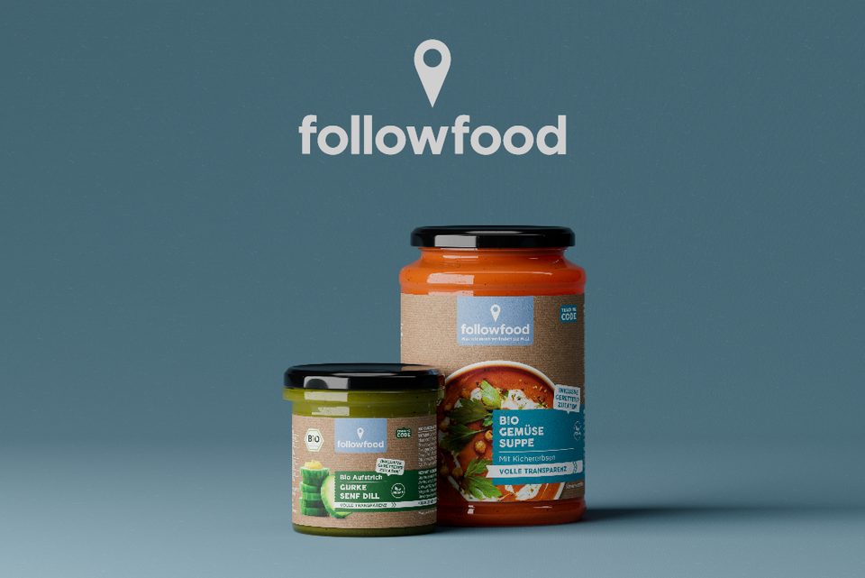 followfood brand logo above two organic product jars (cucumber spread and vegetable soup) against a blue-grey background
